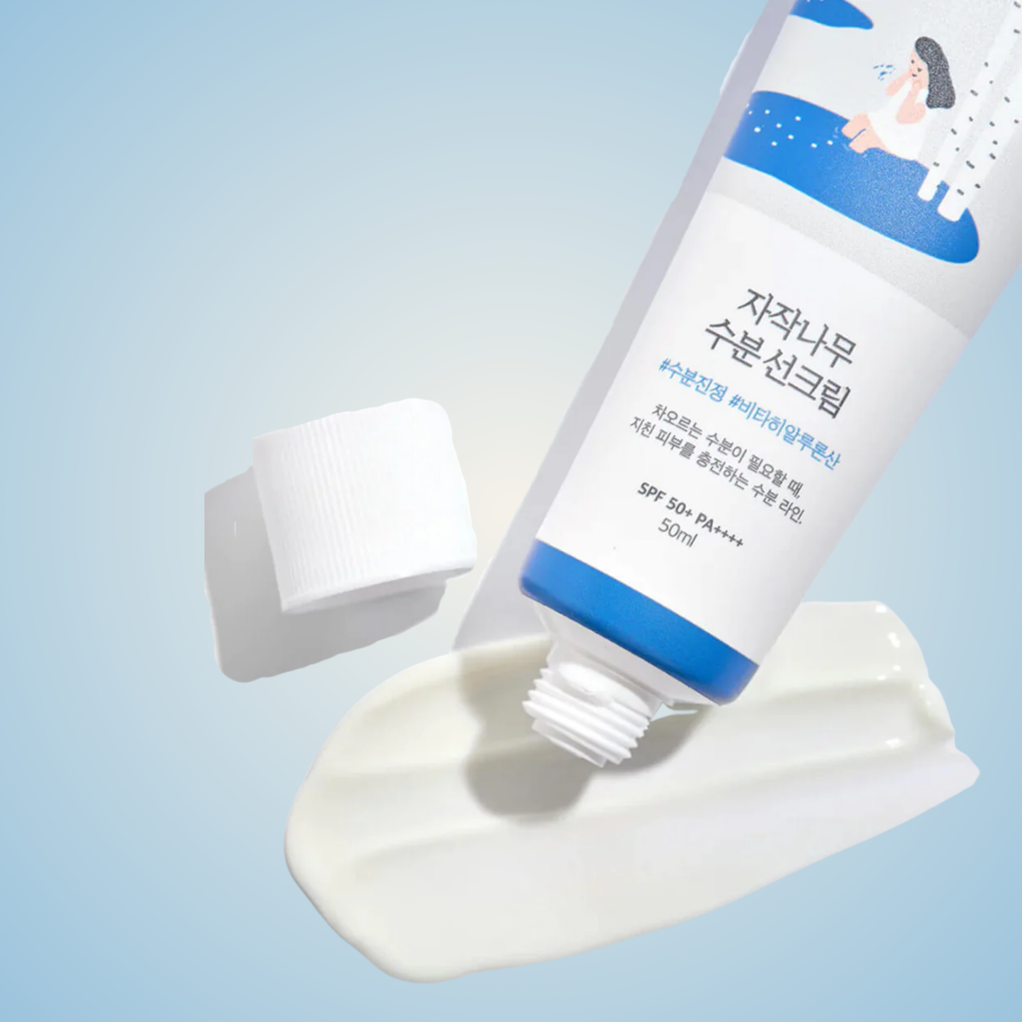 ROUND LAB Birch Juice Moisturizing Sunscreen – smooth hydrating cream texture with high SPF protection.