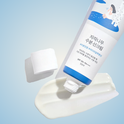 ROUND LAB Birch Juice Moisturizing Sunscreen – smooth hydrating cream texture with high SPF protection.