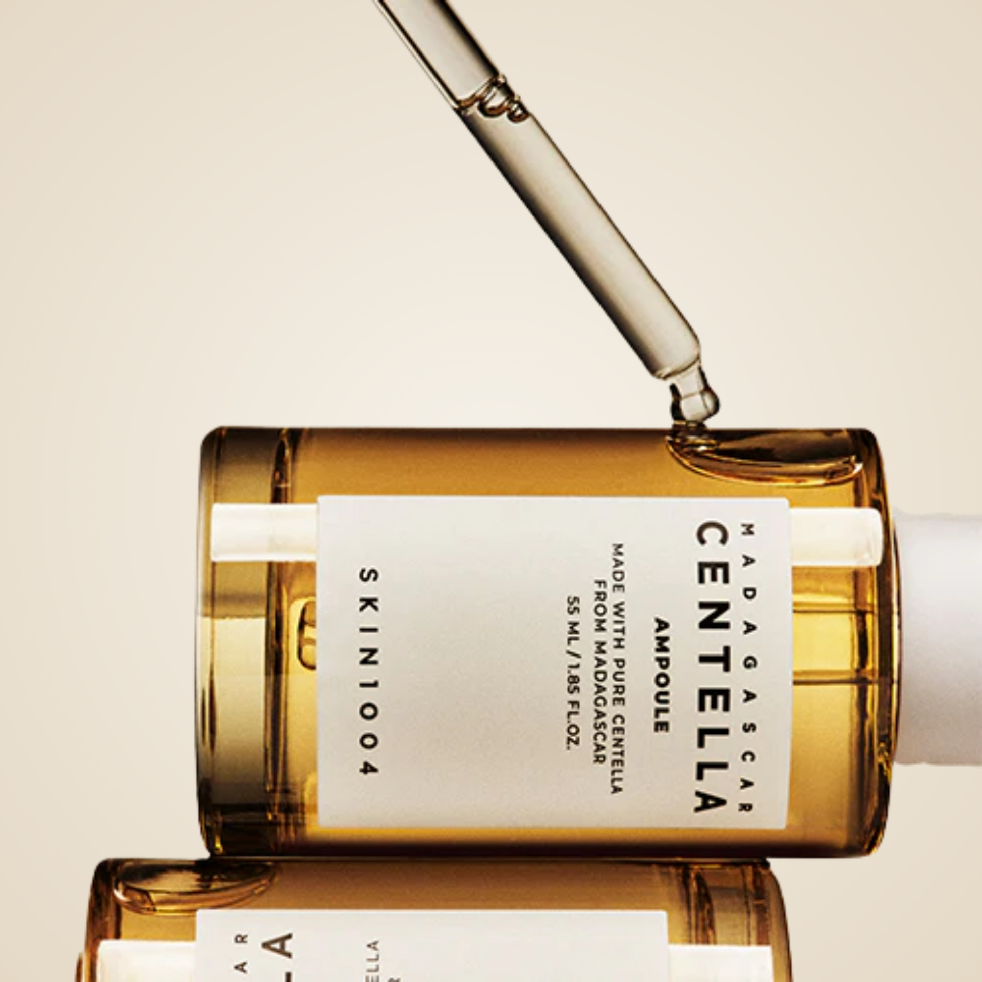 SKIN1004 Madagascar Centella Ampoule dropper releasing serum – soothing centella formula for sensitive skin care.