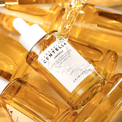 SKIN1004 Madagascar Centella Ampoule being poured – concentrated centella extract for hydration and skin barrier support.