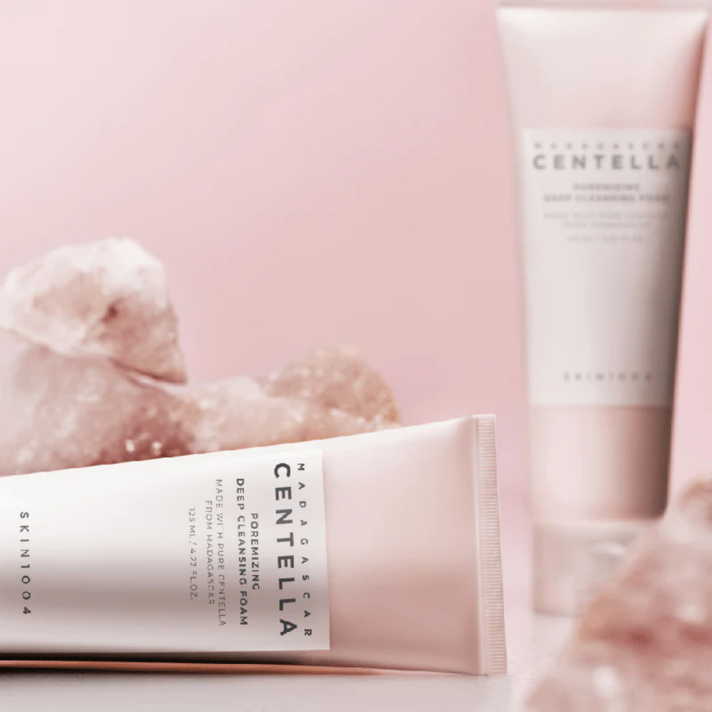 SKIN1004 Madagascar Centella Poremizing Deep Cleansing Foam styled with pink minerals – refreshing cleanser for balanced skin.