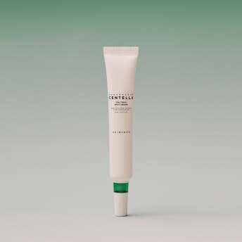 SKIN1004 Madagascar Centella Tea-Trica Spot Cream 20ml — spot cream tube on a green display.