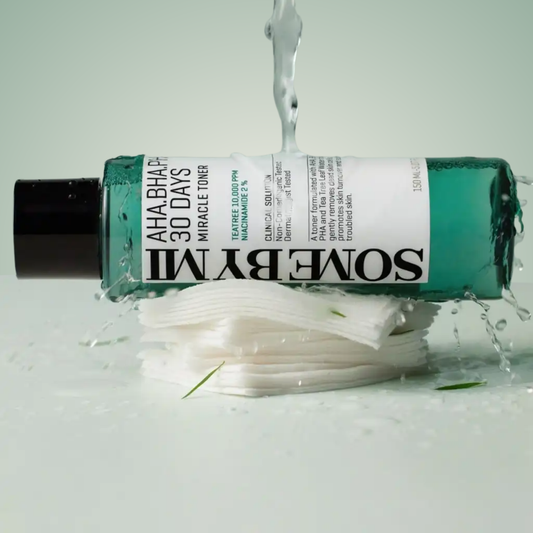 Flatlay of SOME BY MI Miracle Toner 150ml with cotton pads – exfoliating toner for acne-prone, uneven skin