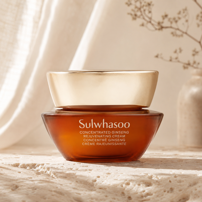 Sulwhasoo Concentrated Ginseng Rejuvenating Cream displayed on warm travertine with soft morning sunlight in a luxury Korean skincare hero photo.