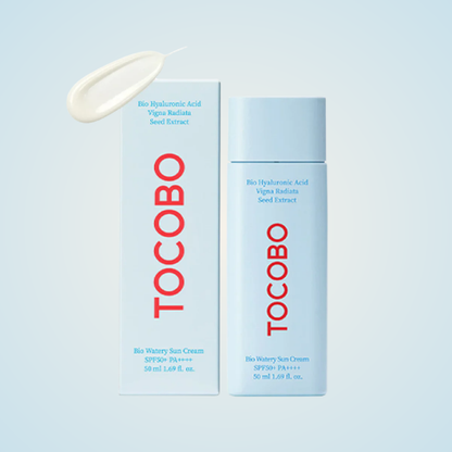 TOCOBO Bio Watery Sun Cream SPF50+ PA++++ with box packaging and soft cream texture on blue background
