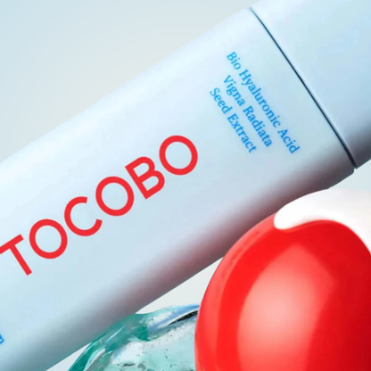 Close-up of TOCOBO Bio Watery Sun Cream SPF50+ PA++++ bottle with clear hydrating texture