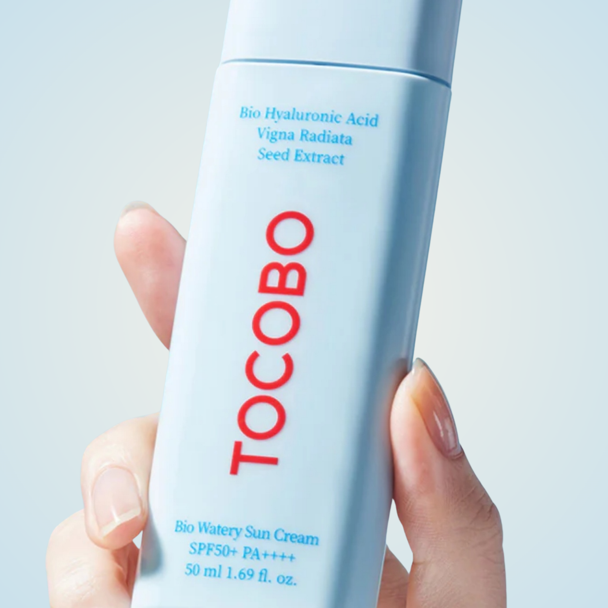 TOCOBO Bio Watery Sun Cream SPF50+ PA++++ held in hand – minimalist light blue packaging