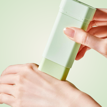 Applying TOCOBO Cica Cooling Sun Stick SPF50+ PA++++ on hand – smooth cooling sunscreen glide