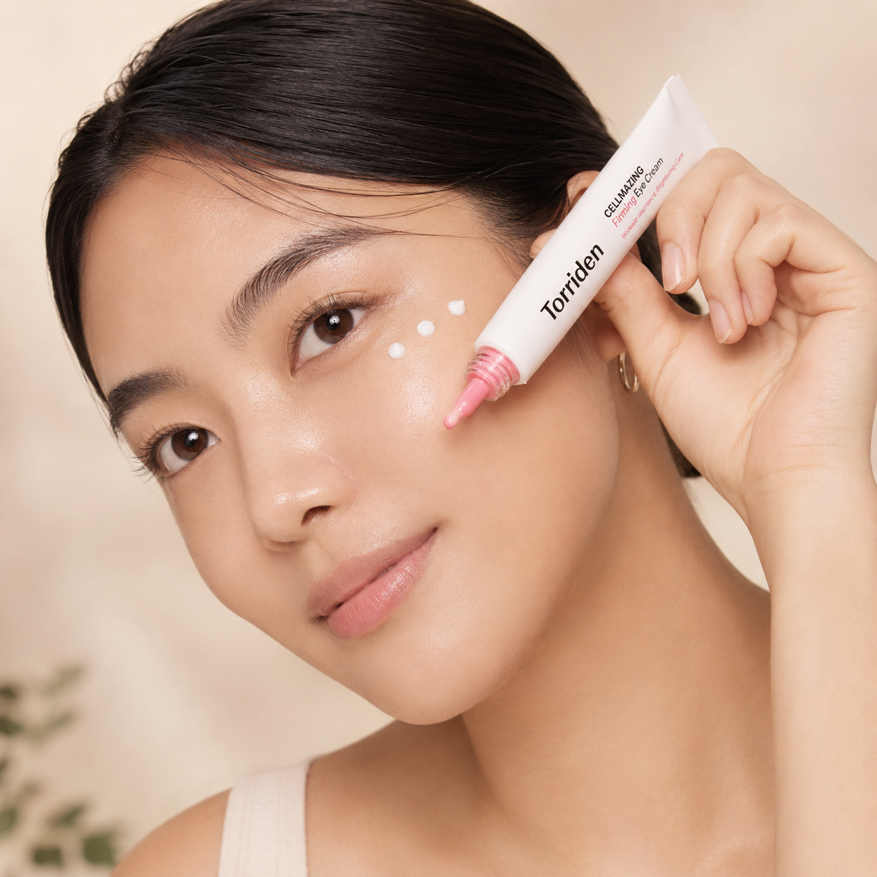 Torriden Cellmazing Firming Eye Cream 30ml being applied around the eye area, showing small dots of cream in a clean Korean skincare application photo.