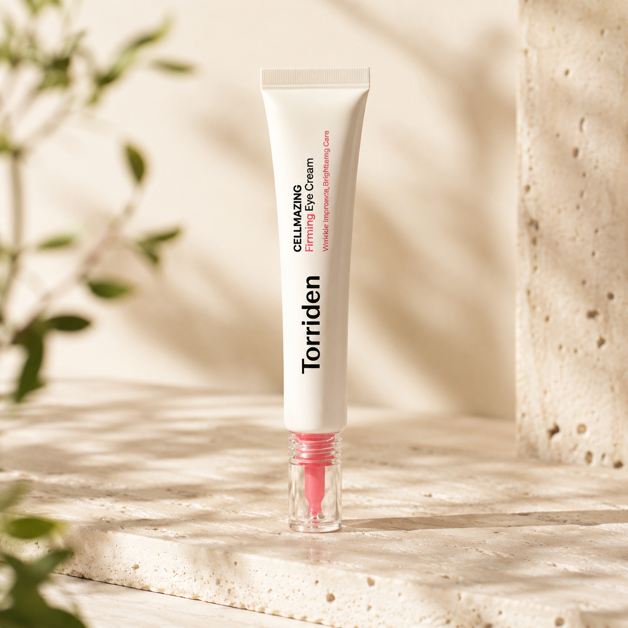 Torriden Cellmazing Firming Eye Cream 30ml displayed upright on warm travertine with soft morning sunlight in a premium Korean skincare hero photo.