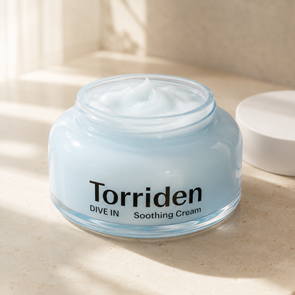 Torriden Dive-In Hyaluronic Acid Soothing Cream 100ml photographed with clear hydration droplets and glossy gel texture for a soothing skincare detail photo.