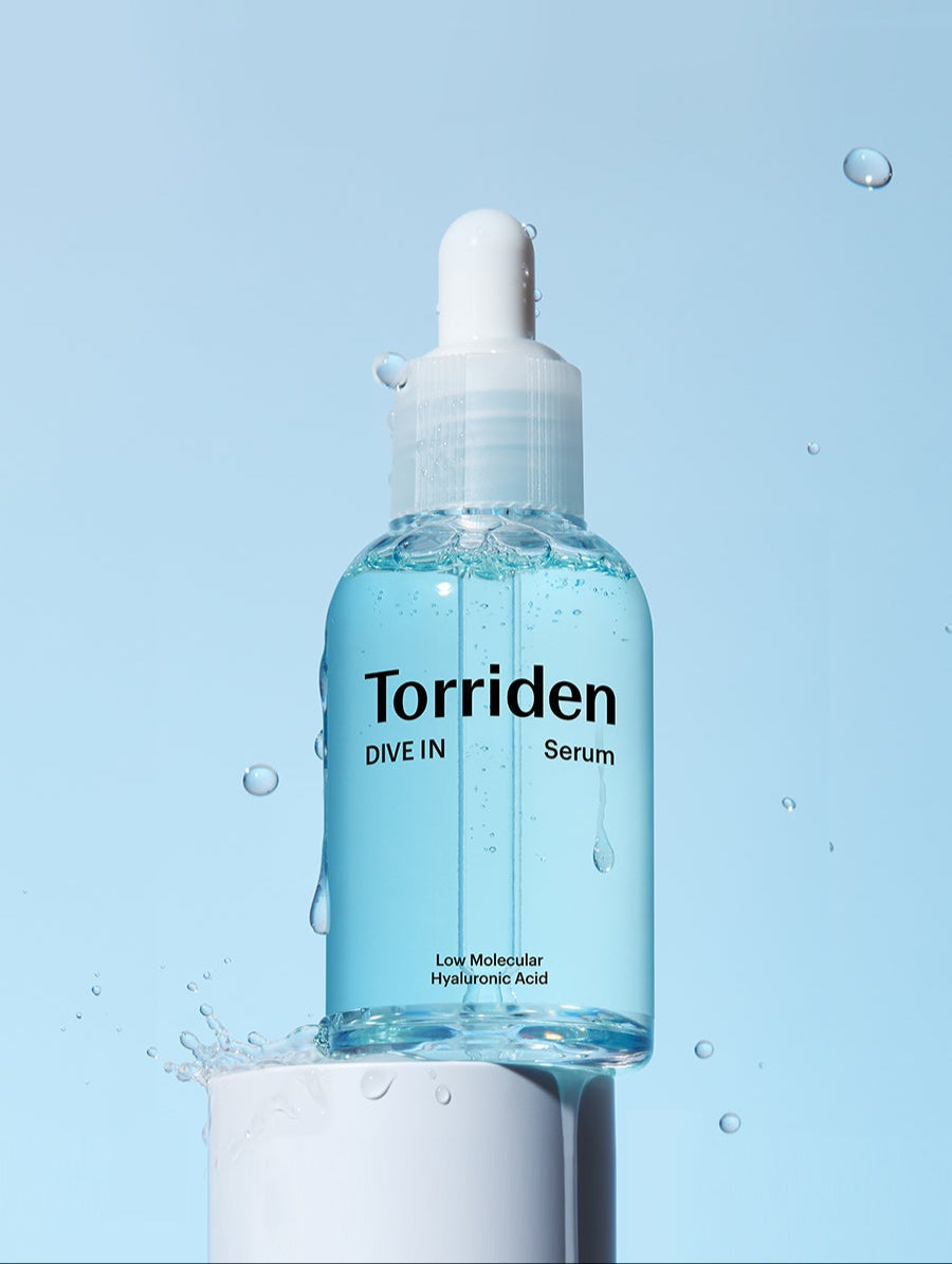Close-up of Torriden DIVE-IN Hyaluronic Acid Serum 40ml bottle with water splash background