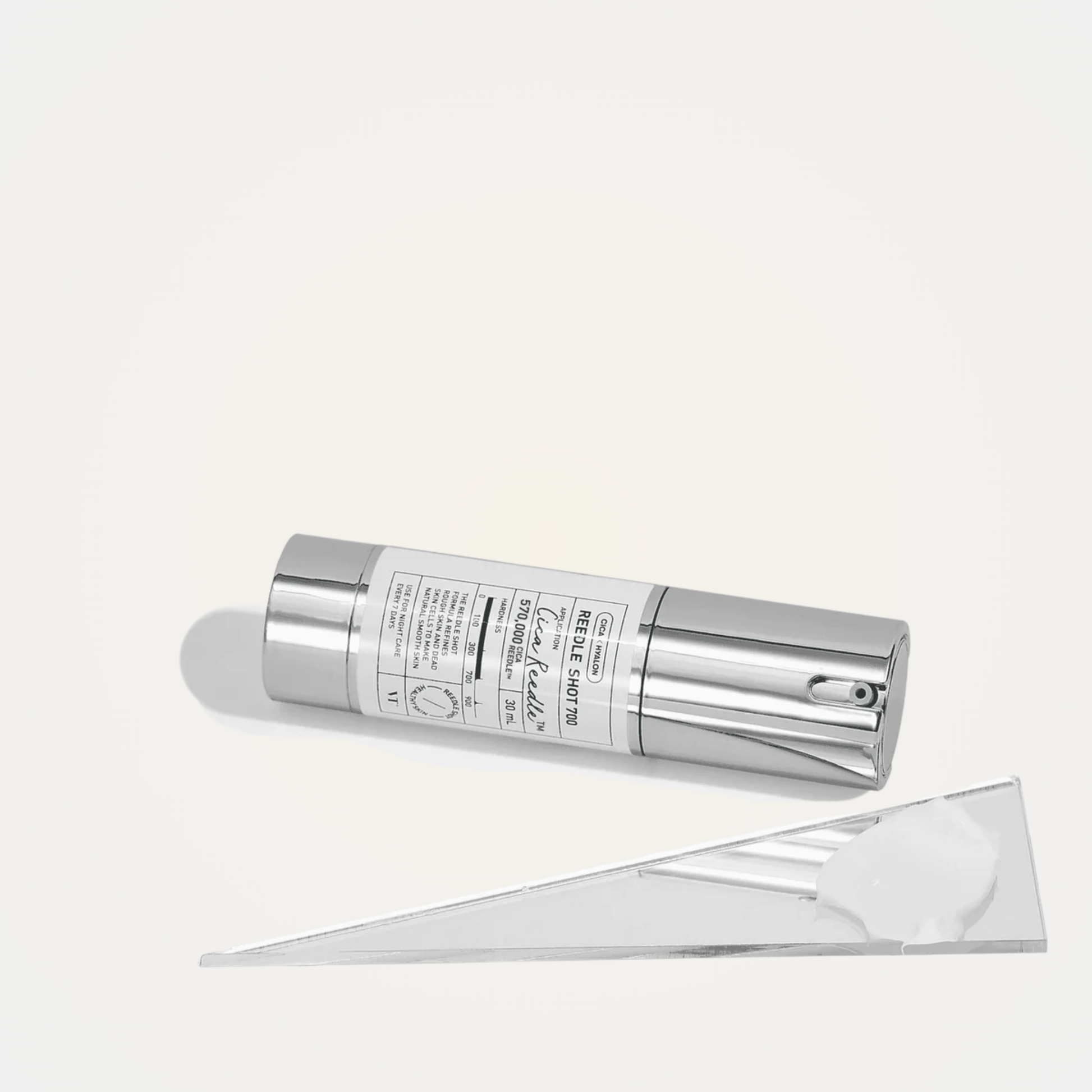 VT Reedle Shot 700 serum flatlay with minimalist mirror and white props – professional skincare display
